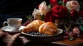 A cup of steaming espresso finding refuge on a vintage table. Accompanied by freshly baked croissants and a fresco floral bouquet