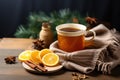 A Cup of Steaming Orange and Cinnamon Winter Tea on Wooden Table. AI Generated