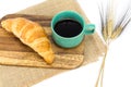 A cup of strong black espresso coffee and fresh croissant Royalty Free Stock Photo