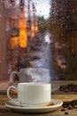 Cup of strong coffee on the rainy window background Royalty Free Stock Photo