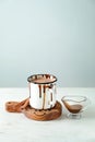 Cup of tasty cocoa and sauce boat on white table Royalty Free Stock Photo