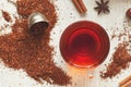 Cup of tasty organic herbal rooibos red tea with Royalty Free Stock Photo