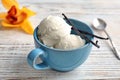 Cup with tasty vanilla ice cream Royalty Free Stock Photo