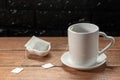 A cup of tea with a tea bag on a wood board Royalty Free Stock Photo
