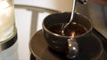 A Cup of Tea being Stirred. Stirring tea with spoon in slow motion. Stir sweet tea cup of hot tea overhead shot Royalty Free Stock Photo