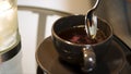 A Cup of Tea being Stirred. Stirring tea with spoon in slow motion. Stir sweet tea cup of hot tea overhead shot Royalty Free Stock Photo