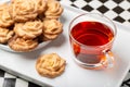 Cup of tea with biscuits on a white tray Royalty Free Stock Photo