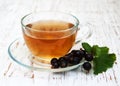 Cup of tea and black currant Royalty Free Stock Photo