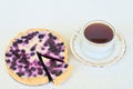 Cup of tea and blueberry pie on a white background - high angle view. Royalty Free Stock Photo