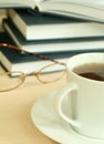 Cup of tea, books and eyeglasses Royalty Free Stock Photo