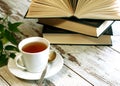 Cup of tea and books on wooden Royalty Free Stock Photo