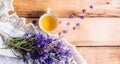 A cup of tea and a bouquet of blue flowers on a wooden background. Long banner Royalty Free Stock Photo