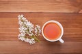 Cup of tea and a bouquet of lilacs