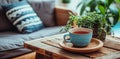 a cup of tea and a bundle of dried leaves on a wooden table