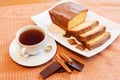 Cup of tea and cake with glaze of chocolate and spices Royalty Free Stock Photo