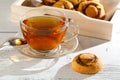 Cup of tea with cakes on wooden tray Royalty Free Stock Photo