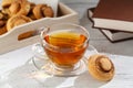 Cup of tea with cakes on wooden tray Royalty Free Stock Photo