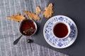 A cup of tea and cedar cone jam