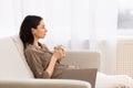 Young woman drinking coffee looking at window Royalty Free Stock Photo