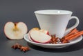 Cup of tea with cinnamon, anise and apple