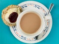 Cup of Tea or Coffee With Scones Clotted Cream and Strawberry Jam Royalty Free Stock Photo