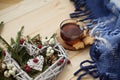 Cup of tea with cookies asterisks with a Christmas wreath heart