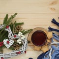 Cup of tea with cookies asterisks with a Christmas wreath heart