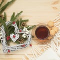 Cup of tea with cookies asterisks with a Christmas wreath heart
