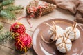 A cup of hot tea with Christmas gingerbread, a branch of a spruce tree on a wooden background Royalty Free Stock Photo