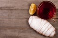 Cup of tea with croissant sprinkled with powdered sugar on old wooden background with copy space for your text. Top view Royalty Free Stock Photo