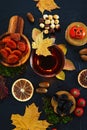 Cup of tea, dried fruits, nuts and leaves on a black background Royalty Free Stock Photo