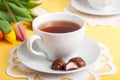 A Cup of Tea with Easter Egg Shaped Chocolate Candies Royalty Free Stock Photo