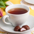 A Cup of Tea with Easter Egg Shaped Chocolate Candies Royalty Free Stock Photo