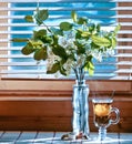 Cup of tea with emon and cherry on wooden background. Window Royalty Free Stock Photo