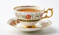 Cup of tea with floral pattern on white background, close up Royalty Free Stock Photo