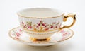 Cup of tea with floral pattern on white background, close up Royalty Free Stock Photo