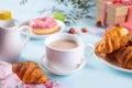 Cup of tea and fresh baked croissants. Healthy lifestyle concept. Romantic style.