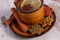 Cup of tea, fresh gingerbread and cinnamon on old wooden background, christmas time Royalty Free Stock Photo