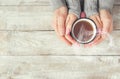 A cup of tea in the hands of a man and a woman. Royalty Free Stock Photo