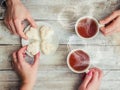 A cup of tea in the hands of a man and a woman. Royalty Free Stock Photo