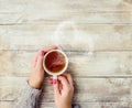 A cup of tea in the hands of a man and a woman. Royalty Free Stock Photo