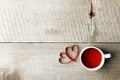 Cup of tea with heart shape on vintage wooden table, minimal concept of valentine mother day morning breakfast