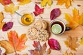 Cup of tea, honey, cookies and autumn leaves on wooden table. Top view Royalty Free Stock Photo