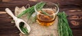 cup of tea from horsetail, made from fresh potion, from pharmacy mortar. Horsetail infusions are used as a diuretic for