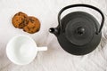 Cup of tea, iron teapot and cookies on the white Royalty Free Stock Photo