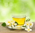 Cup of tea with jasmine flowers Royalty Free Stock Photo