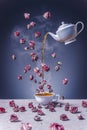 Cup of tea with kettle and roses Royalty Free Stock Photo