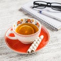 Cup of tea with lemon, biscuits and an open blank notebook Royalty Free Stock Photo