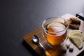 Cup of tea with lemon on black granite background Royalty Free Stock Photo