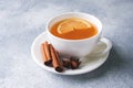 Cup of tea with lemon and brown sugar, cinnamon and anise on the table Royalty Free Stock Photo